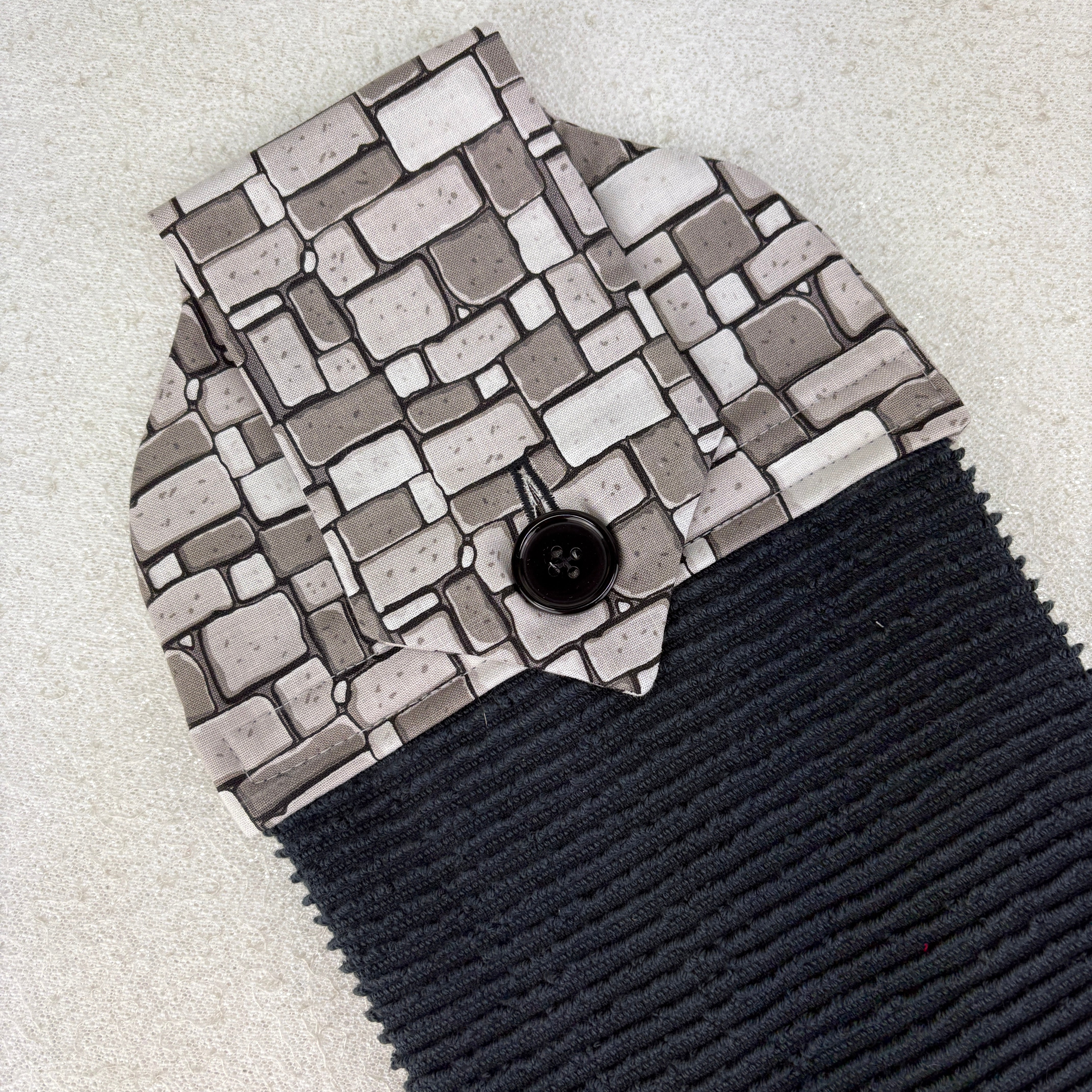 kitchen towel with grey stone wall design