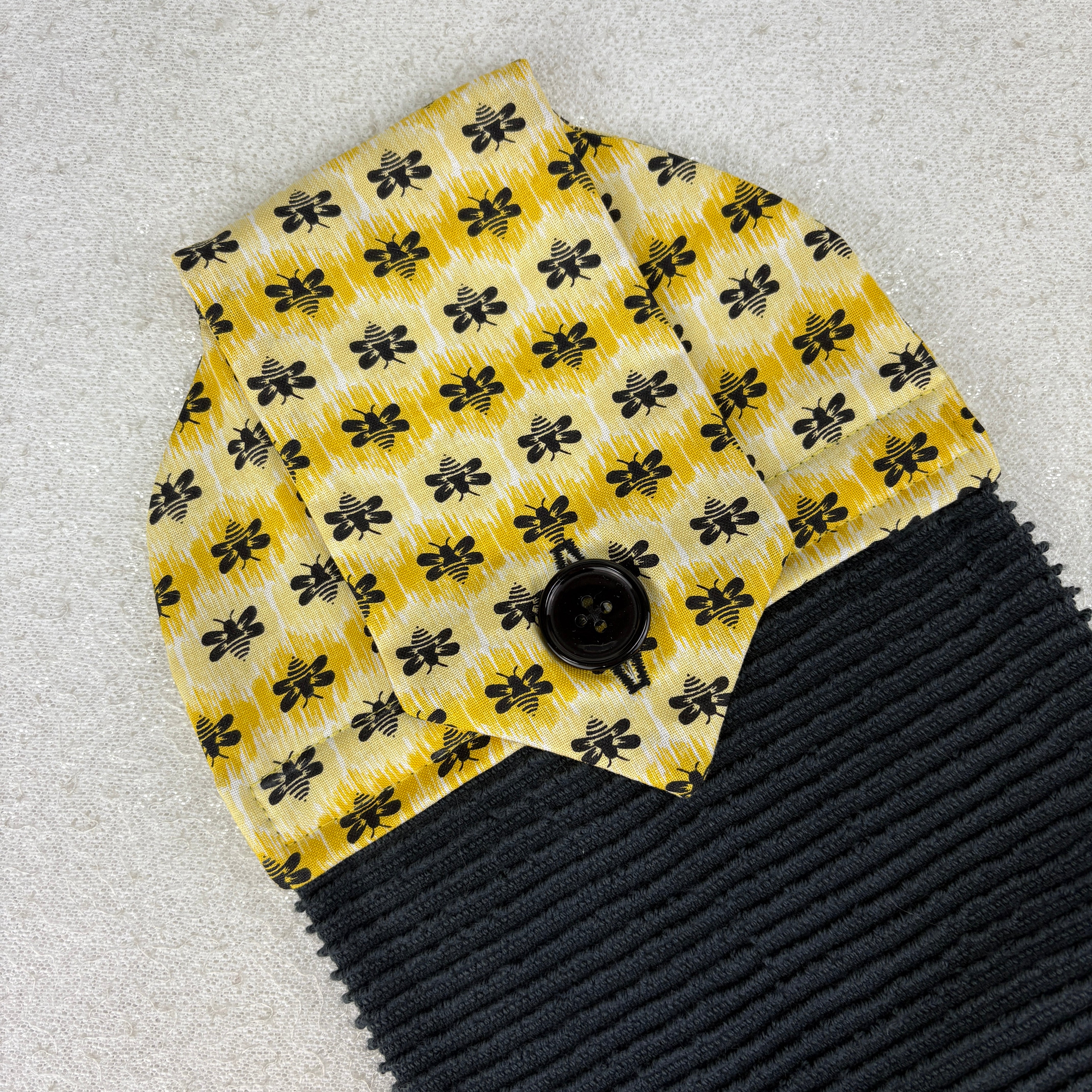 kitchen towel with bees and shades of yellow