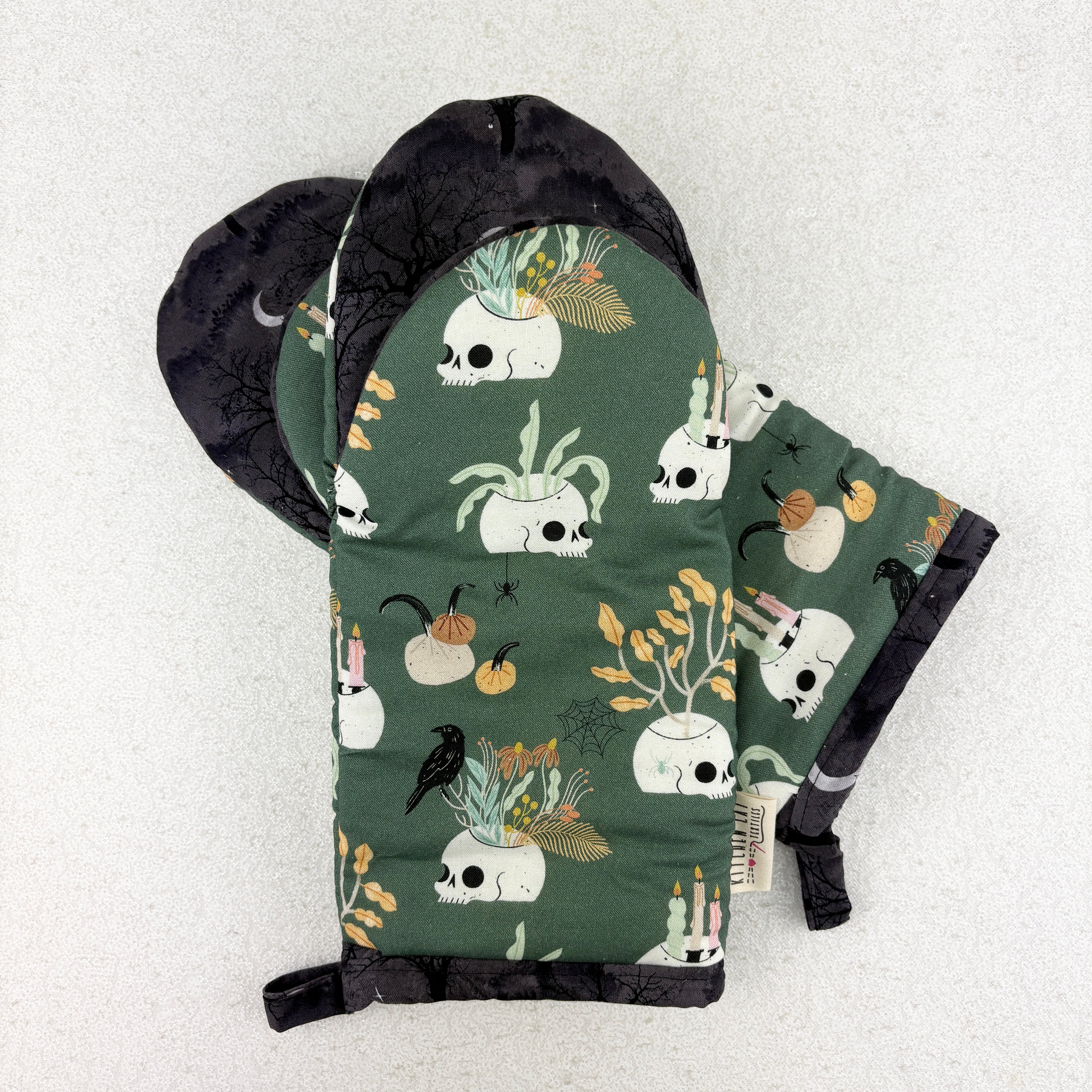 oven mitts with skulls, ravens and flowers