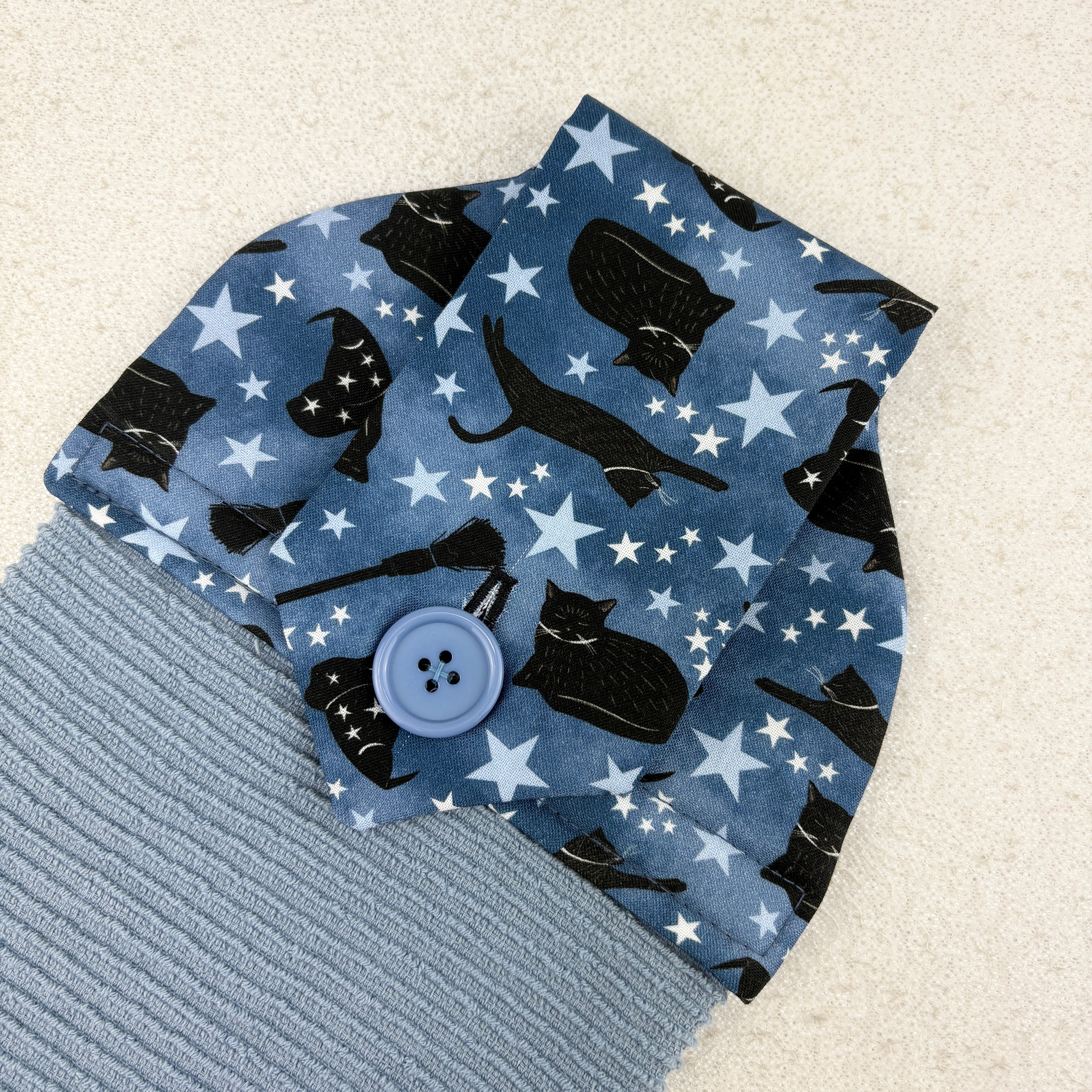 kitchen towel with black cvats and witch hats