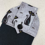 Load image into Gallery viewer, kitchen towel with black cats and spider webs
