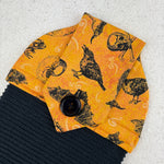 Load image into Gallery viewer, kitchen towel with skulls, crows, witch hats, bats and frogs
