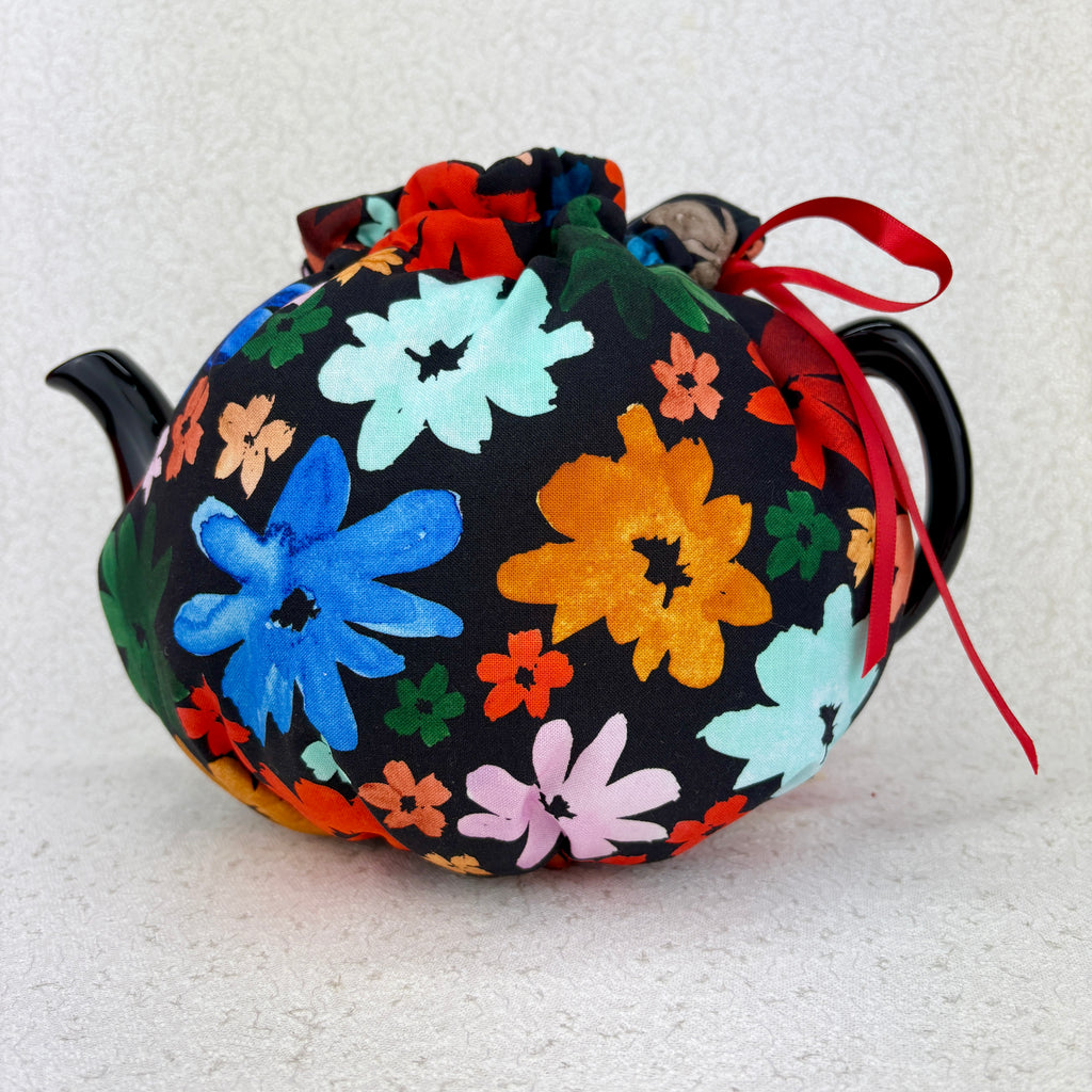 6-10 cup tea cosy with black background and bright flowers