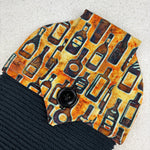 Load image into Gallery viewer, kitchen towel with pattern of vintage whiskey bottles
