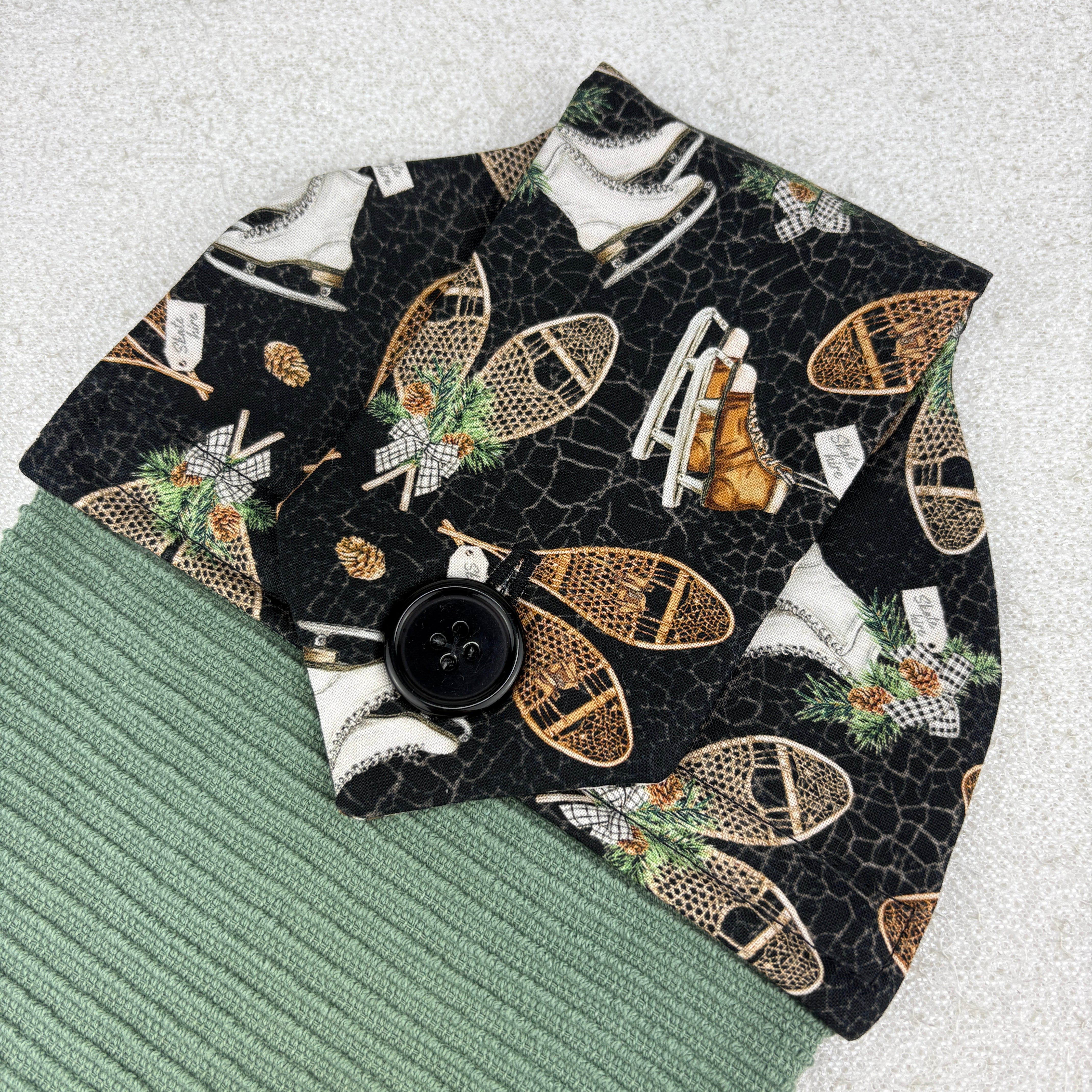 kitchen towel with vintage skating and snowshoe pattern