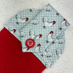 Load image into Gallery viewer, cotton topped towel with chicken pattern and red button on a gray background
