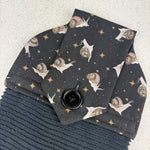 Load image into Gallery viewer, cotton topped black towel with mystic snail pattern
