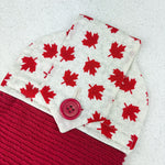 Load image into Gallery viewer, Cotton topped kitchen towel featuring maple leaves and a turkish cotton towel.  Closure is finished with a hand sewn button
