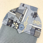Load image into Gallery viewer, Hand made kitchen towel with a cotton top featuring nautical themes.  The towel is finished with a hand sewn button
